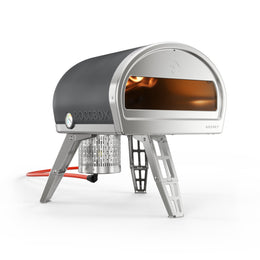 Grey Roccbox comes with oven, gas burner, gas regulator, pizza peel, bottle opener and user manual/recipe book by Gozney