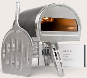 Grey Roccbox comes with oven, gas burner, gas regulator, pizza peel, bottle opener and user manual/recipe book by Gozney